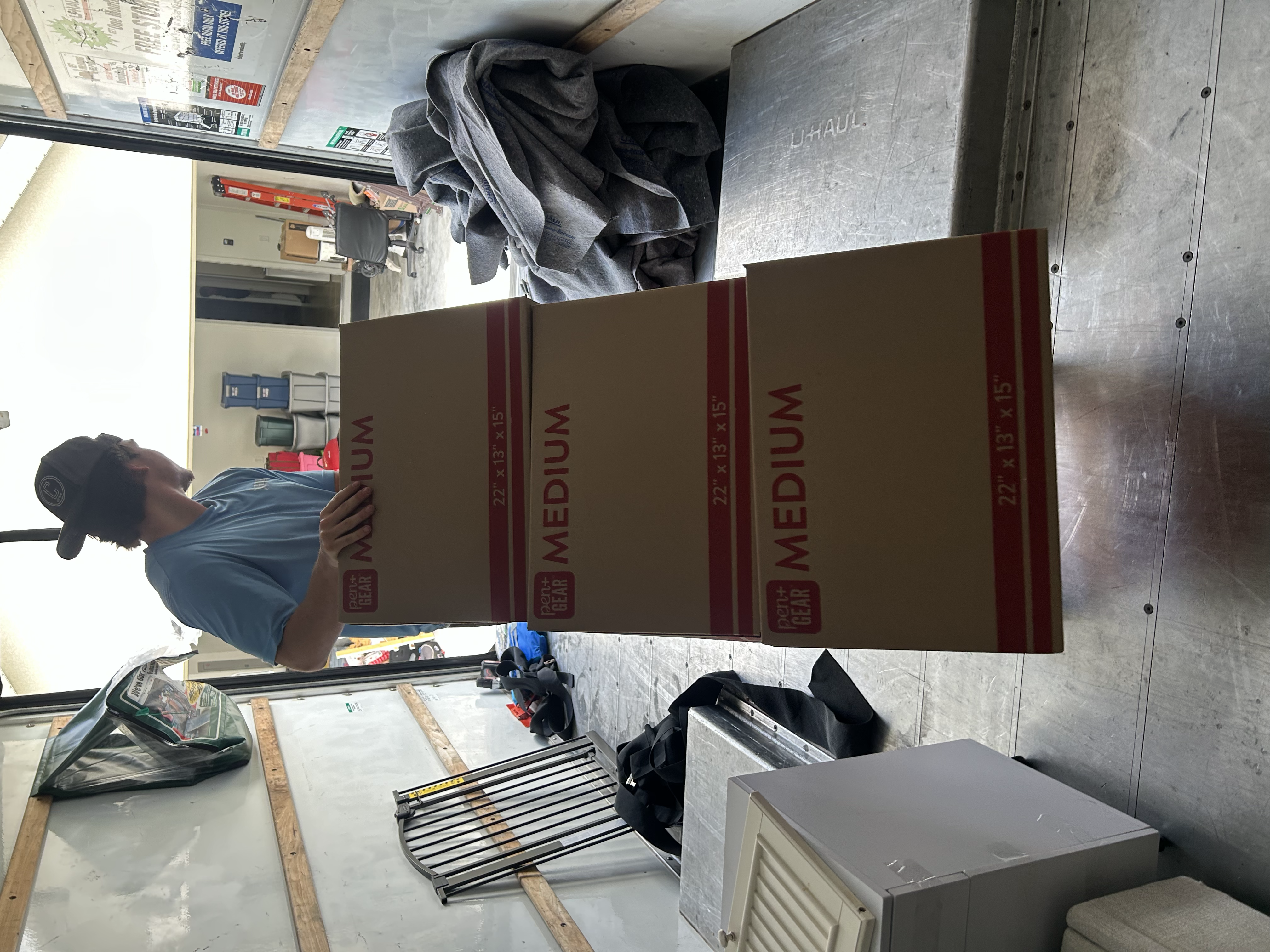 Gym Bros mover stacking boxes in moving truck